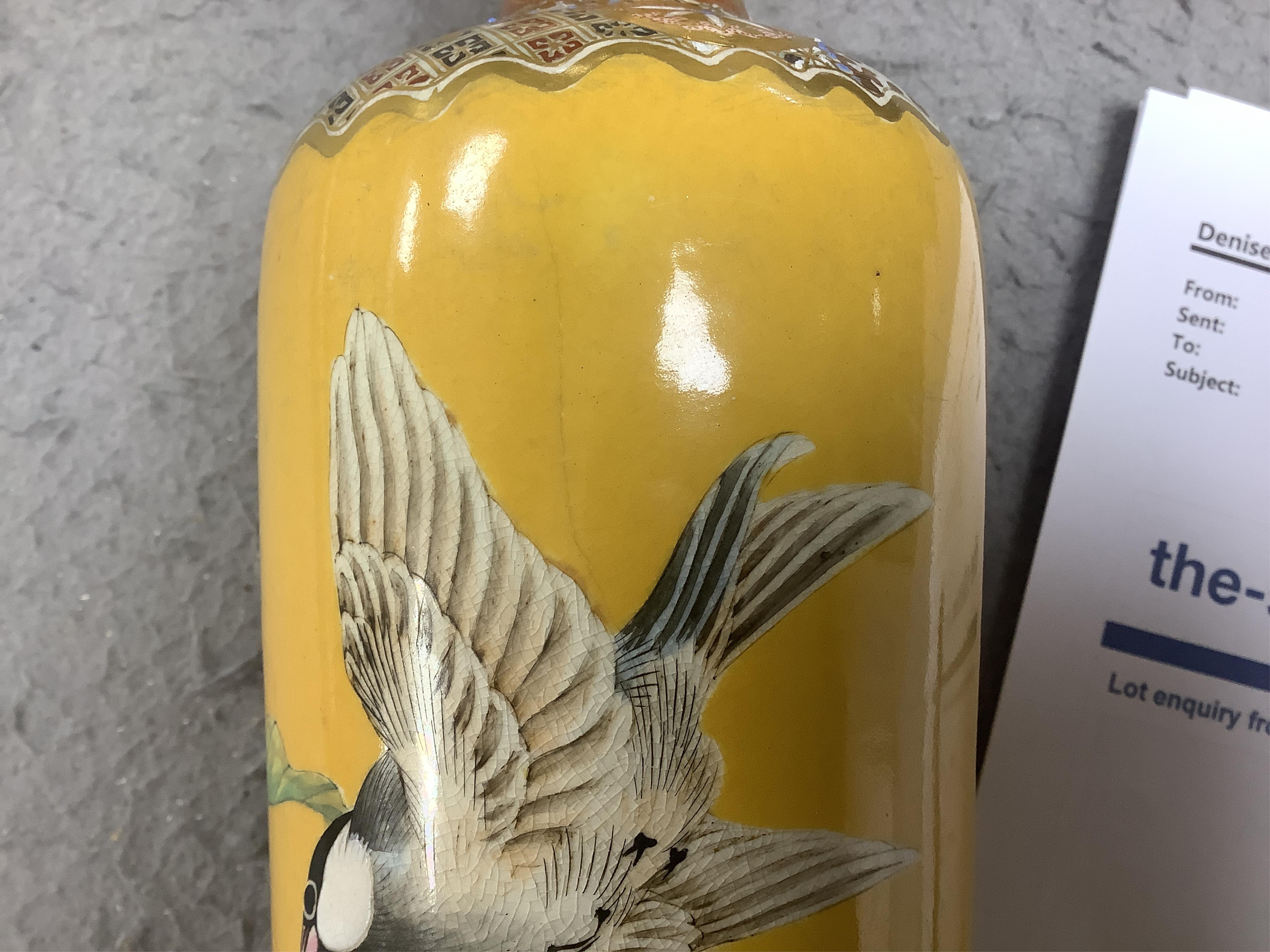 A Japanese Satsuma tall vase, Meiji period, by Taizan Yohei III, decorated with birds and blossom on a yellow ground, signed, 37cm high. Condition - hairline crack, otherwise good condition